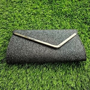 Payless womens clutch bag in silver and black prestine condition